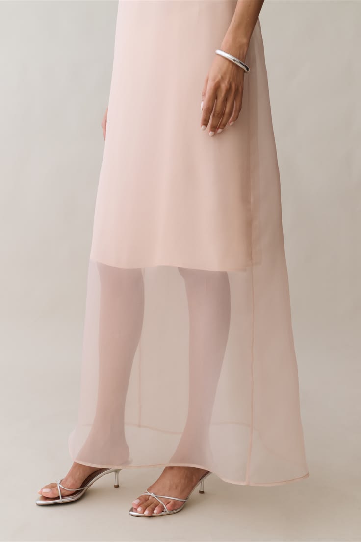 This ethereal blush maxi dress is designed with a clean stra